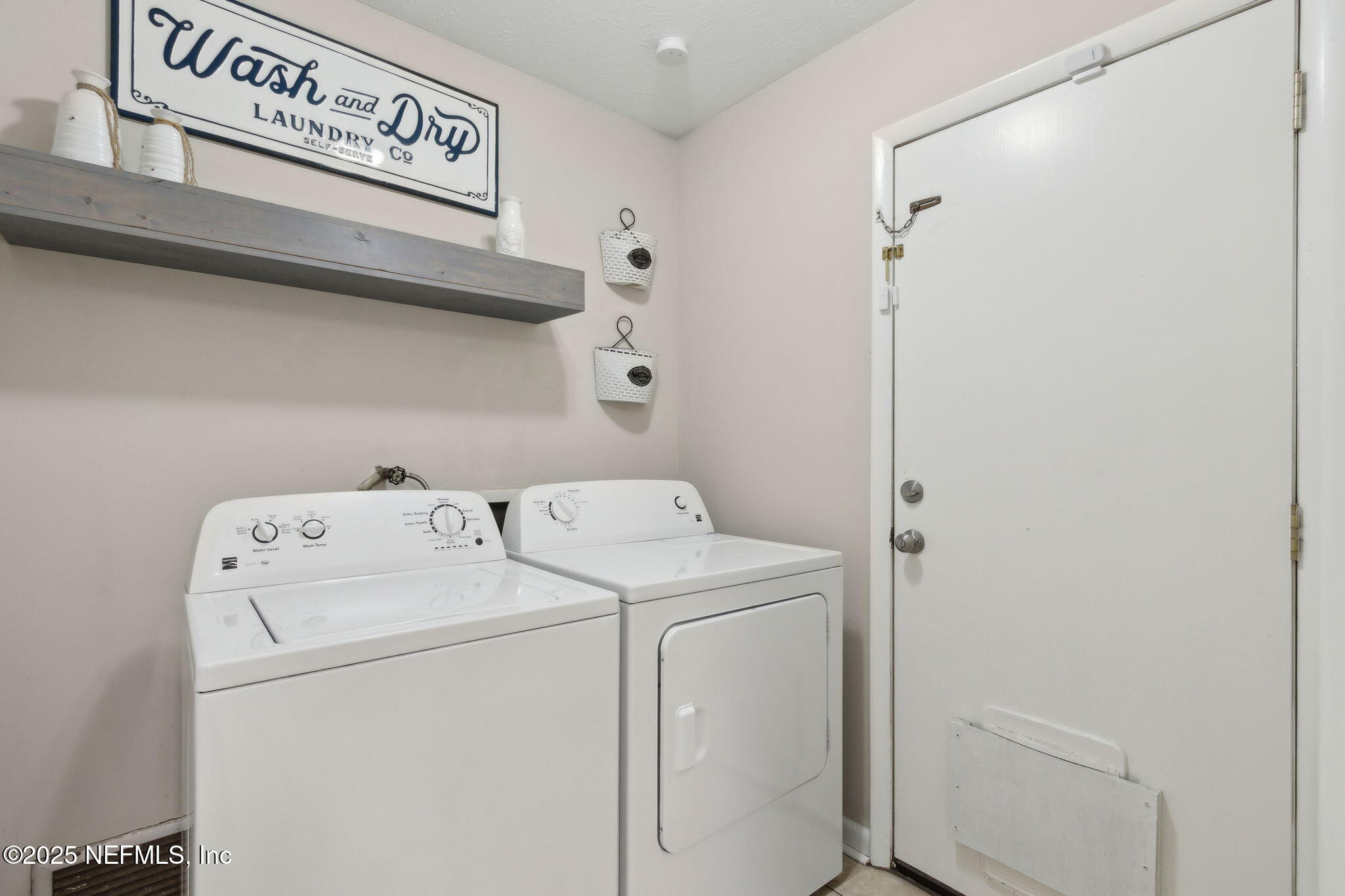 2806 Annette Circle Jacksonville, FL 32216 - Photo 27 of 31 a utility room with dryer and washer