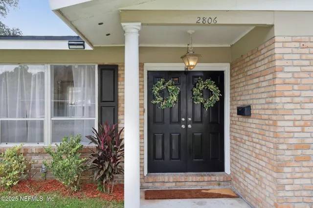 a view of a entryway door front of house