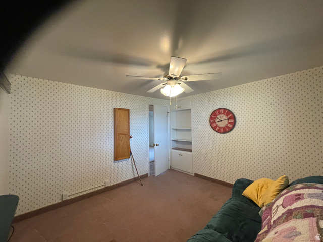 438 East Main Street Elsinore, UT 84724 - Photo 32 of 43 Bedroom used as sewing room additional storage and drip down Ironing board.