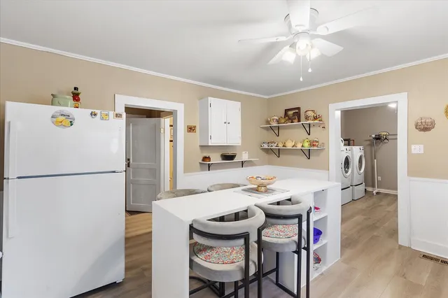 a kitchen with cabinets a sink and appliances