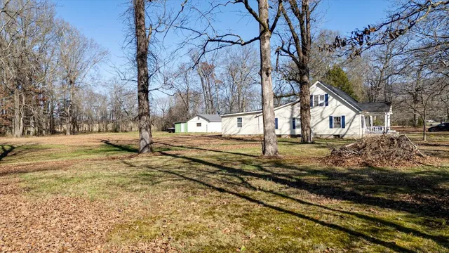 a house view with swimming pool