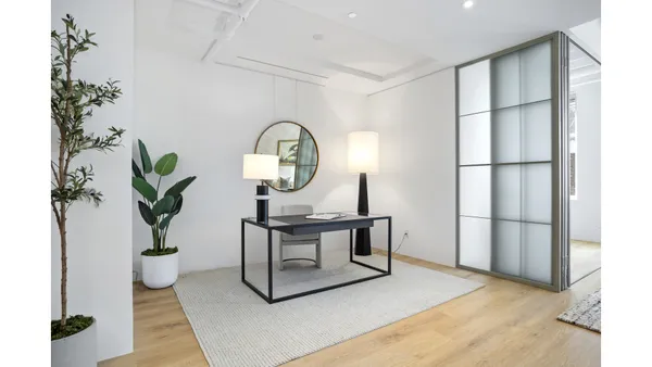 a spacious bedroom with a large bed and a large window