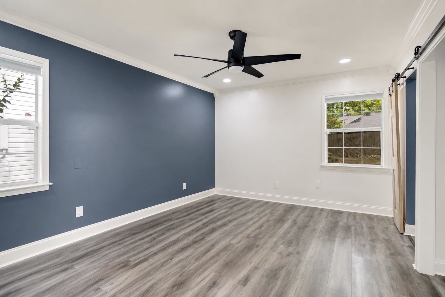 2978 Ruffle Drive Bartlett, TN 38134 - Photo 8 of 12 Spacious room featuring wood-finish flooring, a contemporary ceiling fan, and recessed lighting