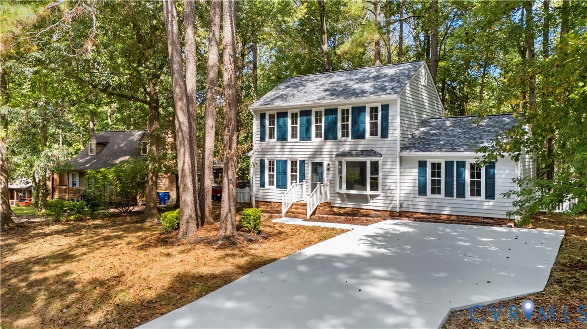 12130 Quito Road Midlothian, VA 23112 - Photo 1 of 41 a front view of a house with a yard