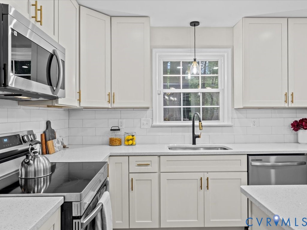 12130 Quito Road Midlothian, VA 23112 - Photo 12 of 41 a kitchen with a sink cabinets and window
