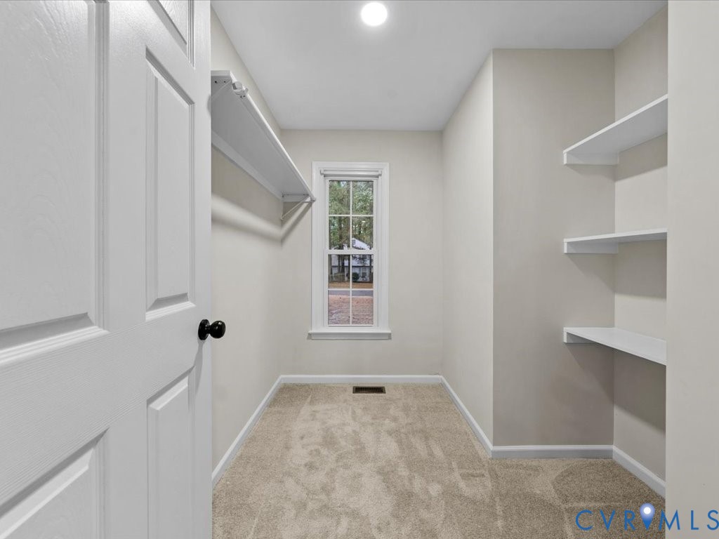 12130 Quito Road Midlothian, VA 23112 - Photo 19 of 41 a view of a hallway with a white walls and a window