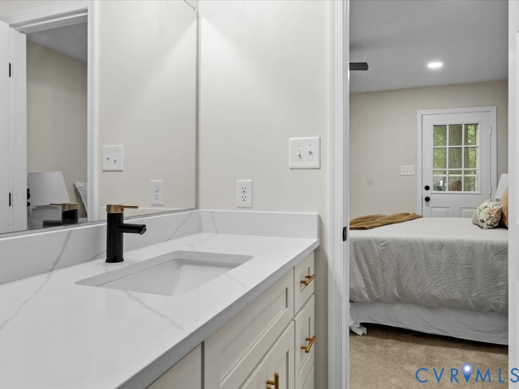12130 Quito Road Midlothian, VA 23112 - Photo 24 of 41 a bathroom with a sink and a mirror