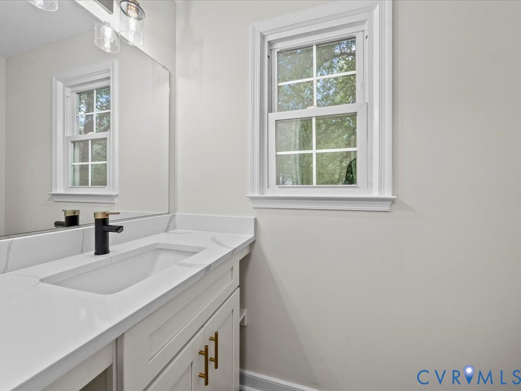 12130 Quito Road Midlothian, VA 23112 - Photo 26 of 41 a bathroom with a sink and a window