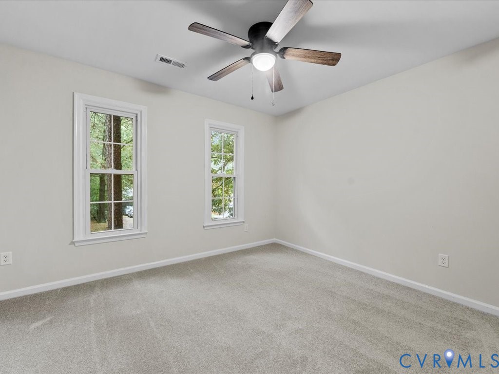 12130 Quito Road Midlothian, VA 23112 - Photo 29 of 41 an empty room with windows and fan