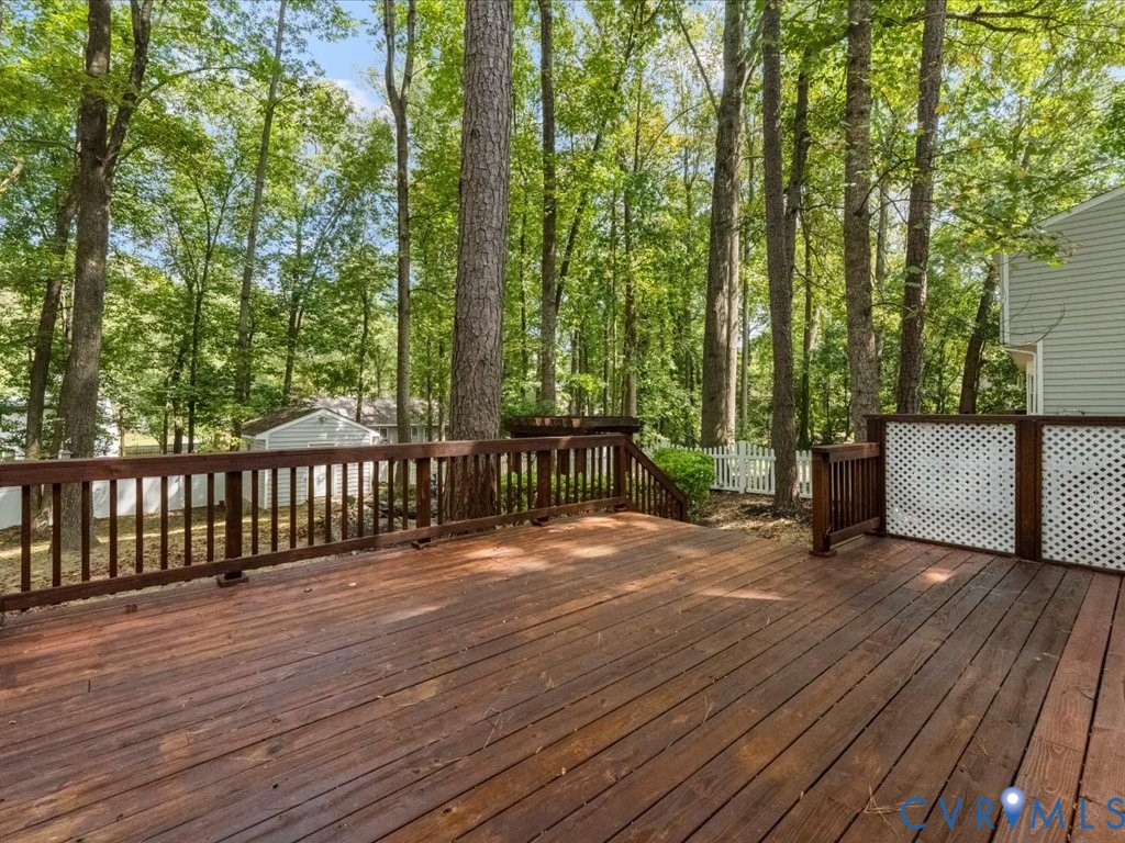 12130 Quito Road Midlothian, VA 23112 - Photo 36 of 41 a view of a deck with wooden floor and fence