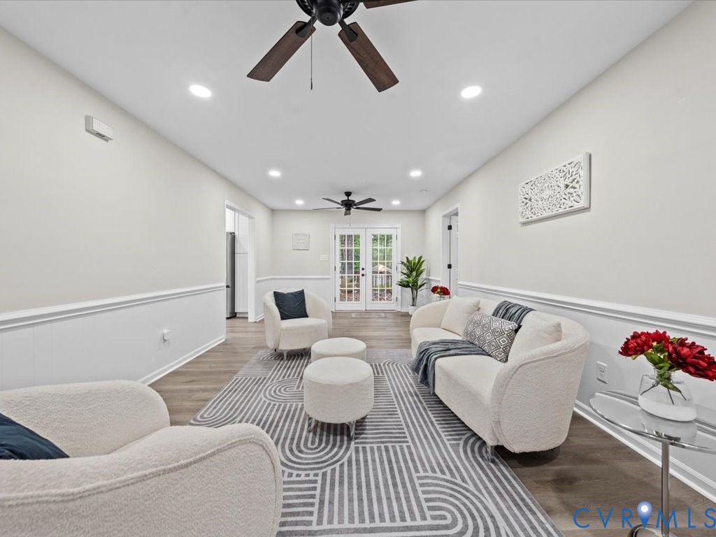 12130 Quito Road Midlothian, VA 23112 - Photo 5 of 41 a living room with furniture and a chandelier