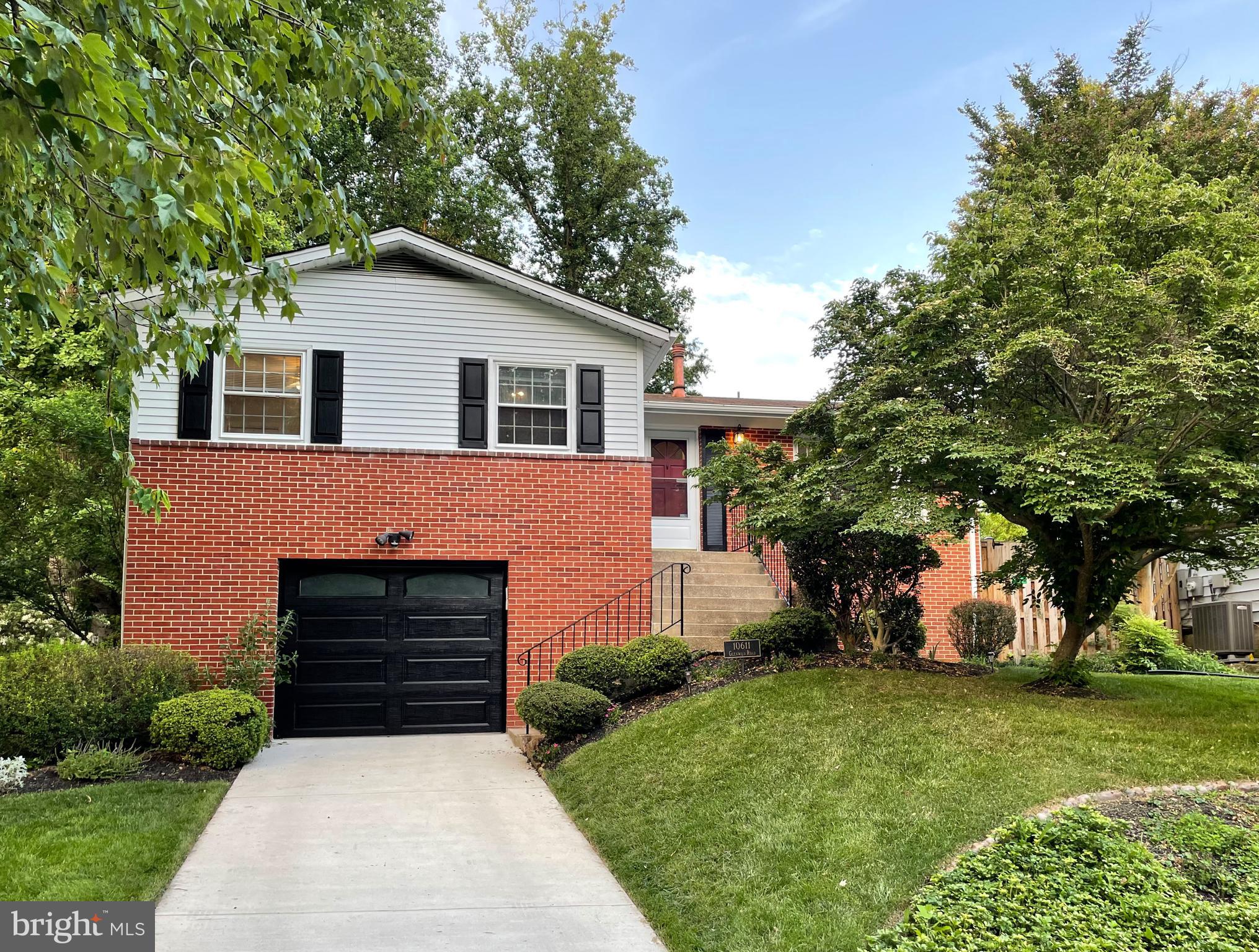 10611 Glenwild Road Silver Spring, MD 20901 - Photo 1 of 39 a front view of a house with garden