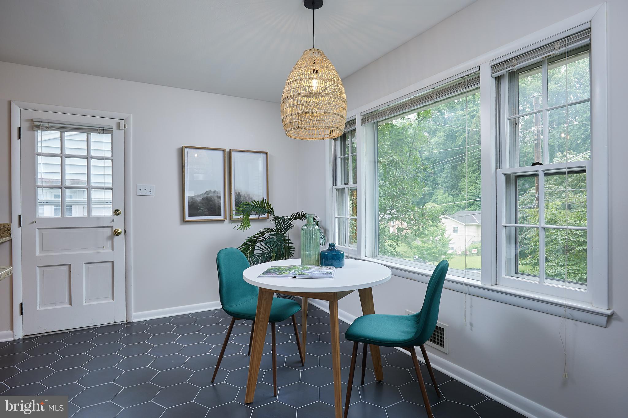 10611 Glenwild Road Silver Spring, MD 20901 - Photo 12 of 39 a view of a dining room with furniture window and outside view