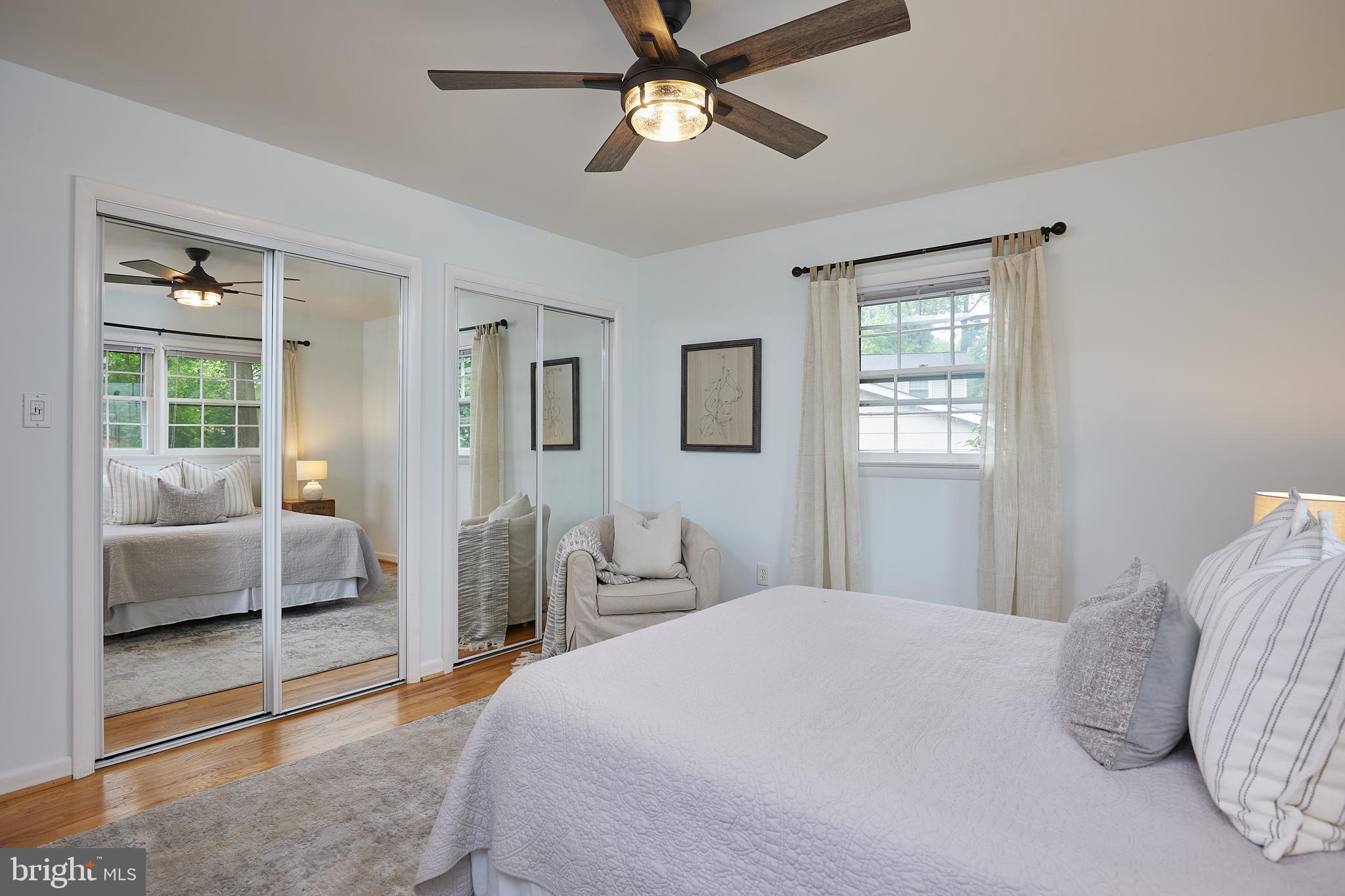 10611 Glenwild Road Silver Spring, MD 20901 - Photo 16 of 39 a bedroom with a large bed and a window