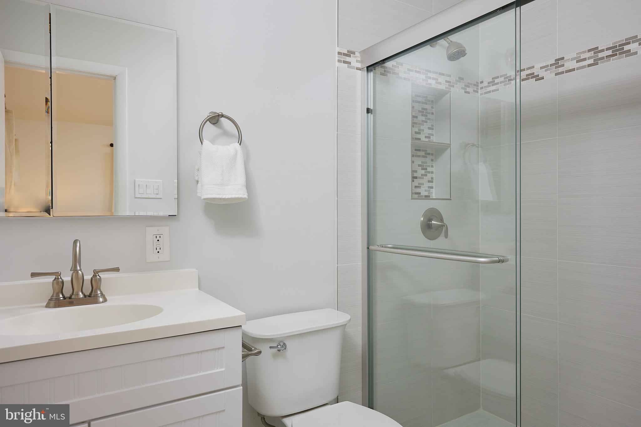 10611 Glenwild Road Silver Spring, MD 20901 - Photo 18 of 39 a bathroom with a sink toilet and shower