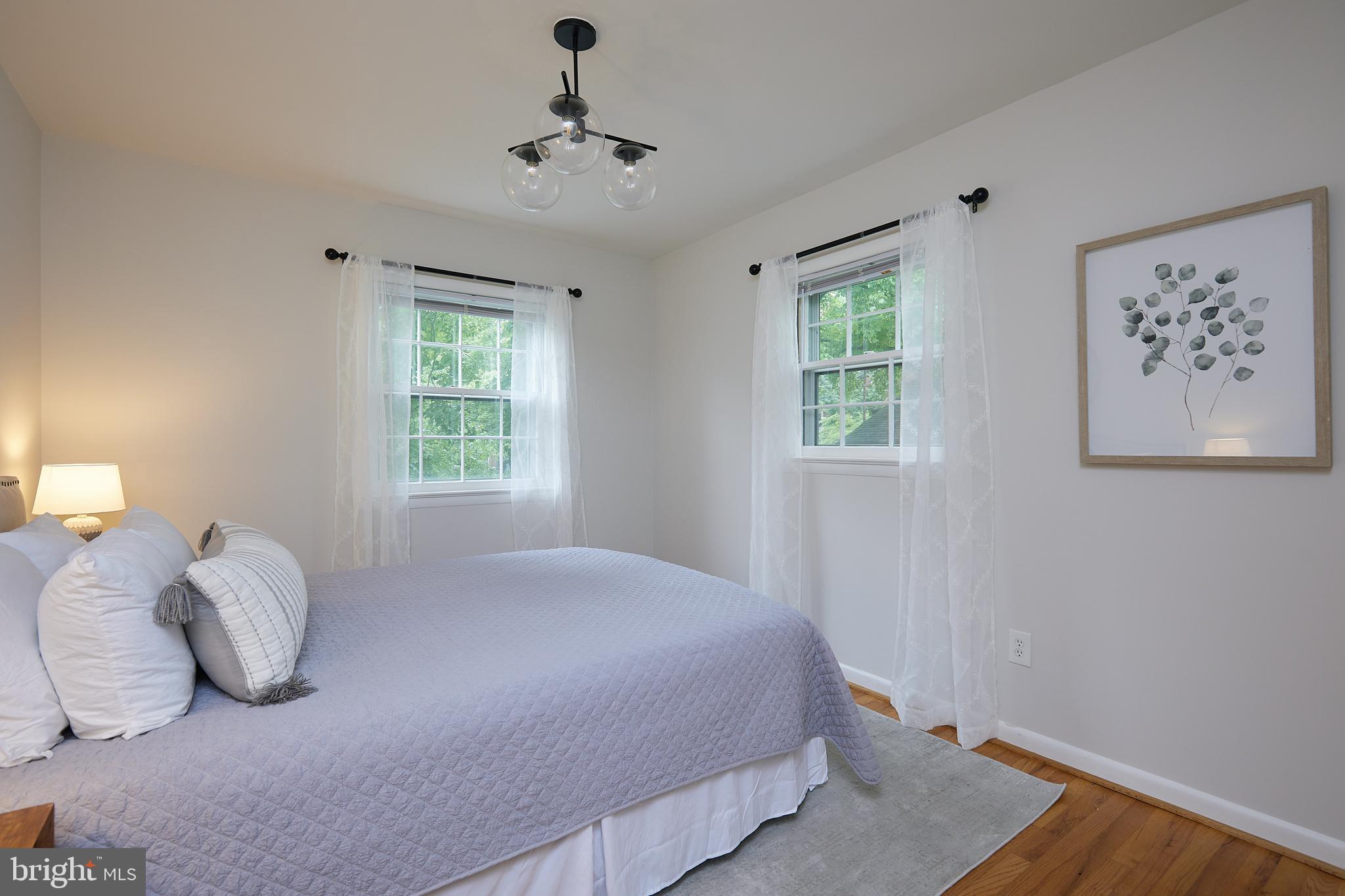 10611 Glenwild Road Silver Spring, MD 20901 - Photo 19 of 39 a bedroom with a bed and a window
