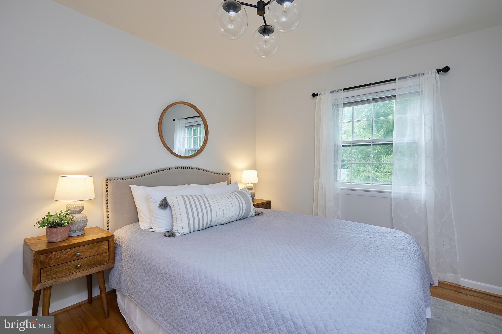 10611 Glenwild Road Silver Spring, MD 20901 - Photo 20 of 39 a bedroom with a bed and a window