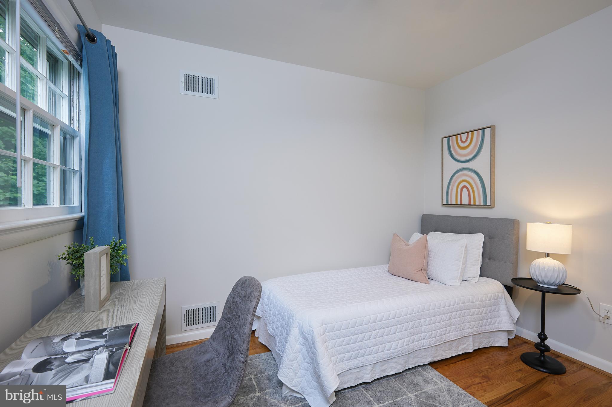 10611 Glenwild Road Silver Spring, MD 20901 - Photo 21 of 39 a bedroom with a bed and a lamp