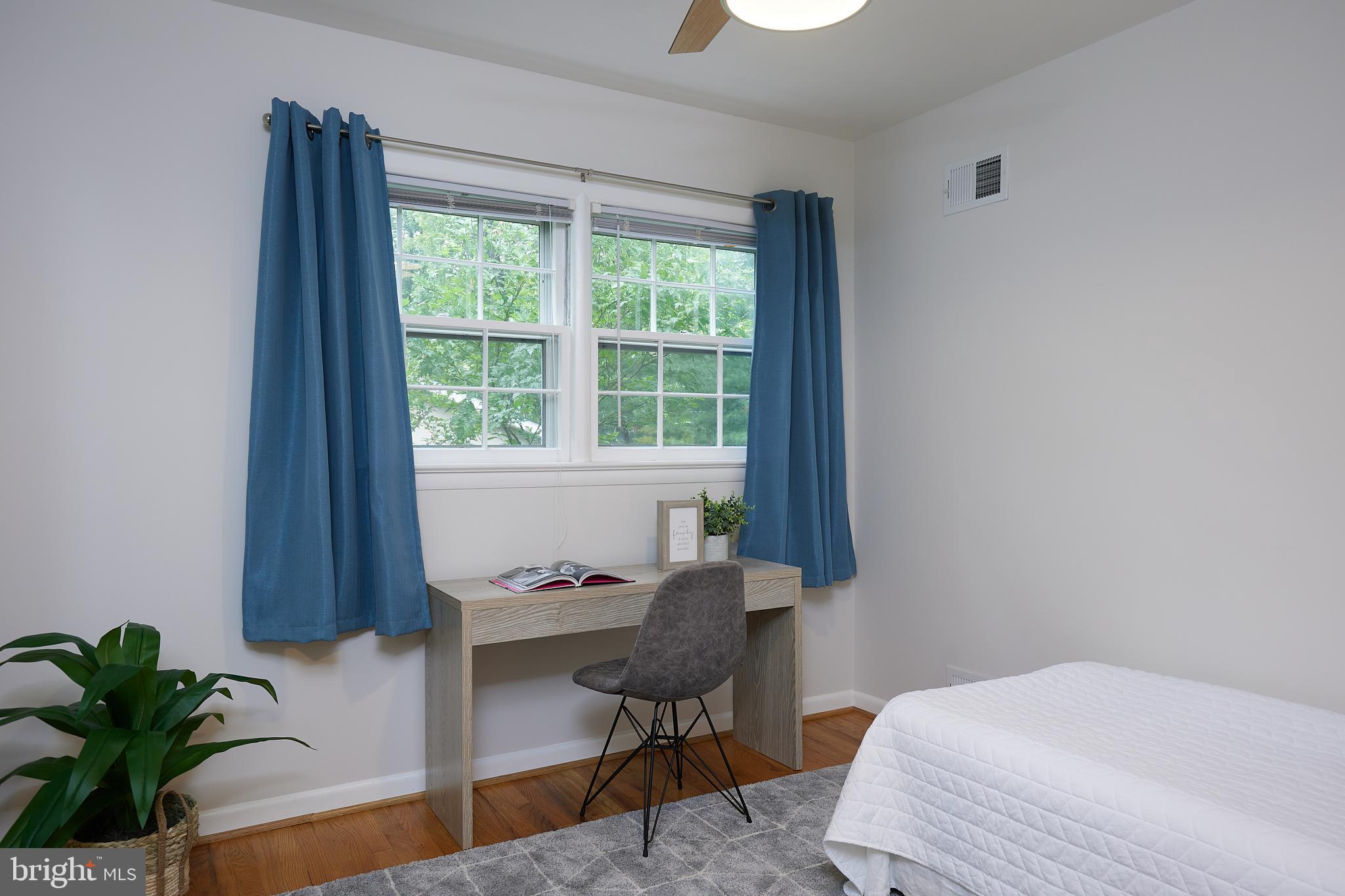 10611 Glenwild Road Silver Spring, MD 20901 - Photo 22 of 39 a bedroom with a bed and a window
