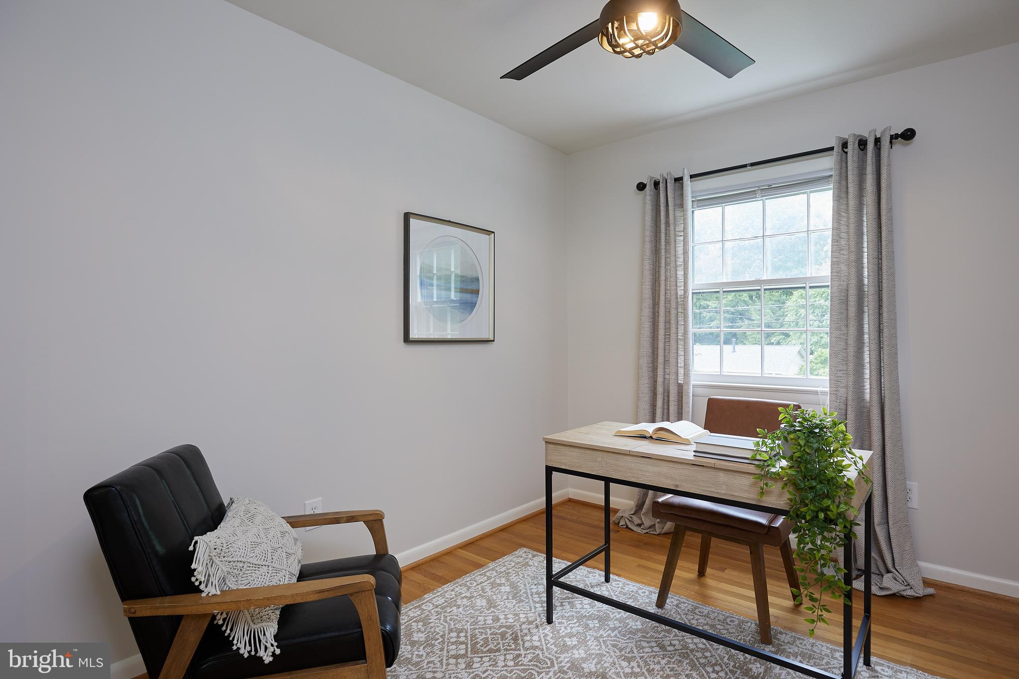 10611 Glenwild Road Silver Spring, MD 20901 - Photo 23 of 39 a view of a workspace with furniture and a window