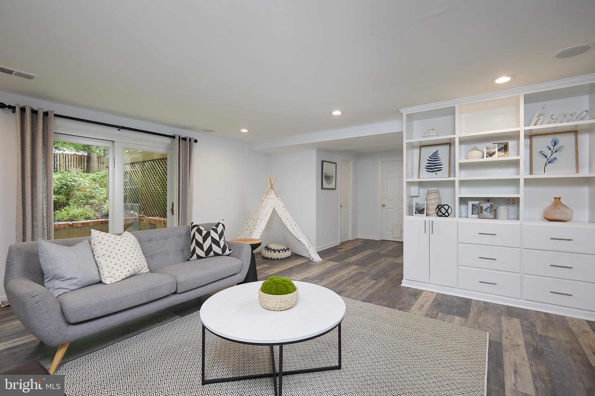 10611 Glenwild Road Silver Spring, MD 20901 - Photo 25 of 39 a living room with furniture and a wooden floor