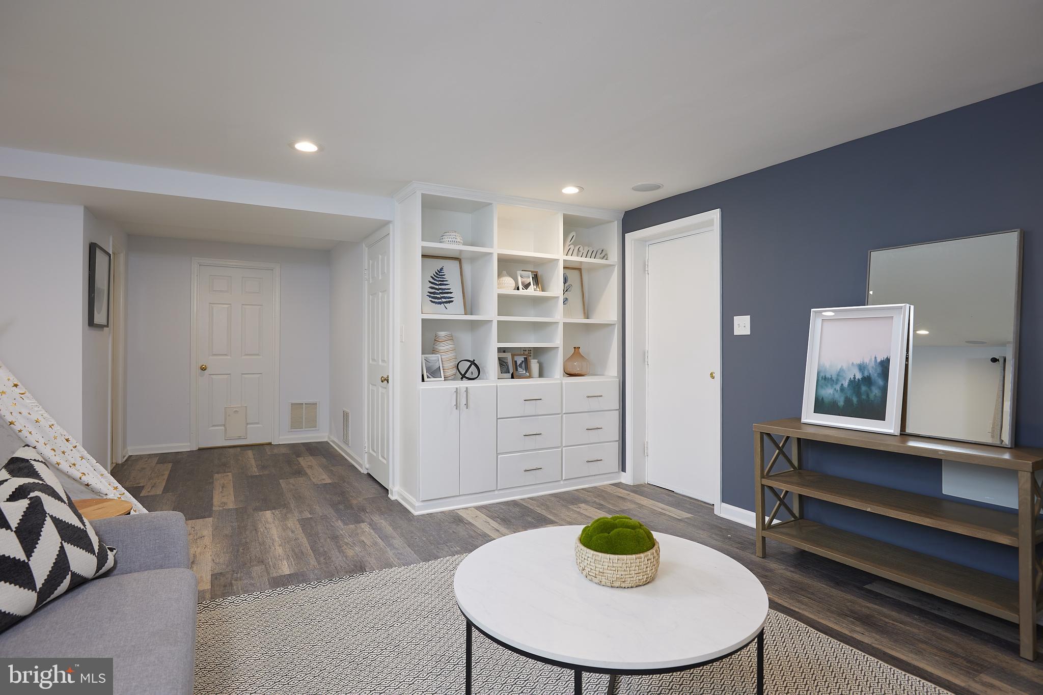 10611 Glenwild Road Silver Spring, MD 20901 - Photo 26 of 39 a living room with furniture and a wooden floor