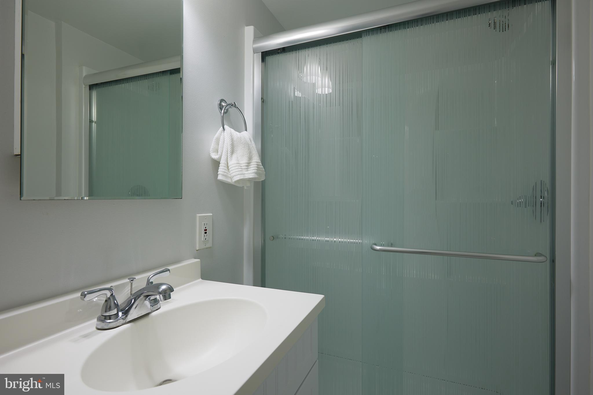 10611 Glenwild Road Silver Spring, MD 20901 - Photo 28 of 39 a bathroom with a sink and mirror