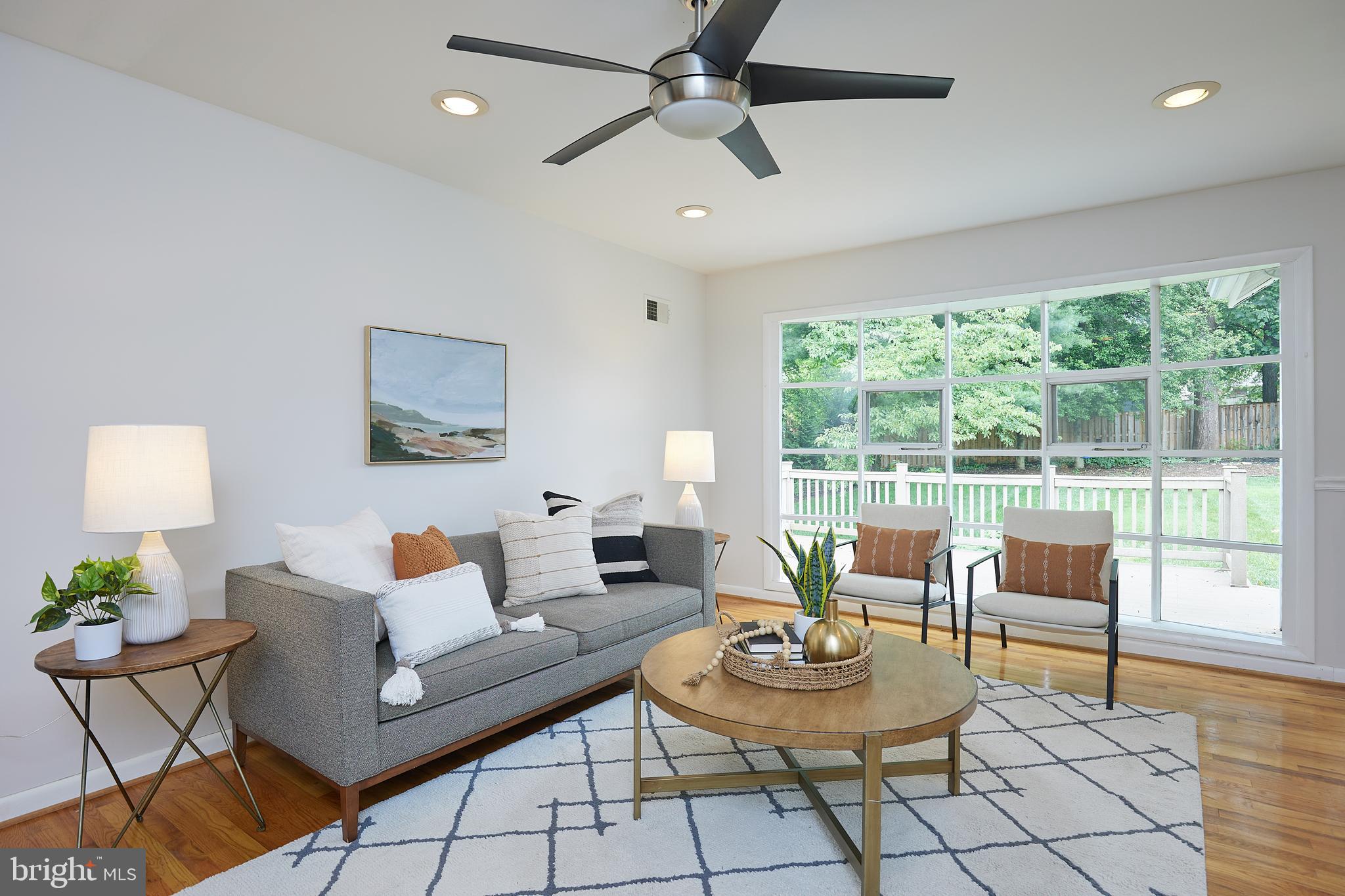 10611 Glenwild Road Silver Spring, MD 20901 - Photo 3 of 39 a living room with furniture and a large window