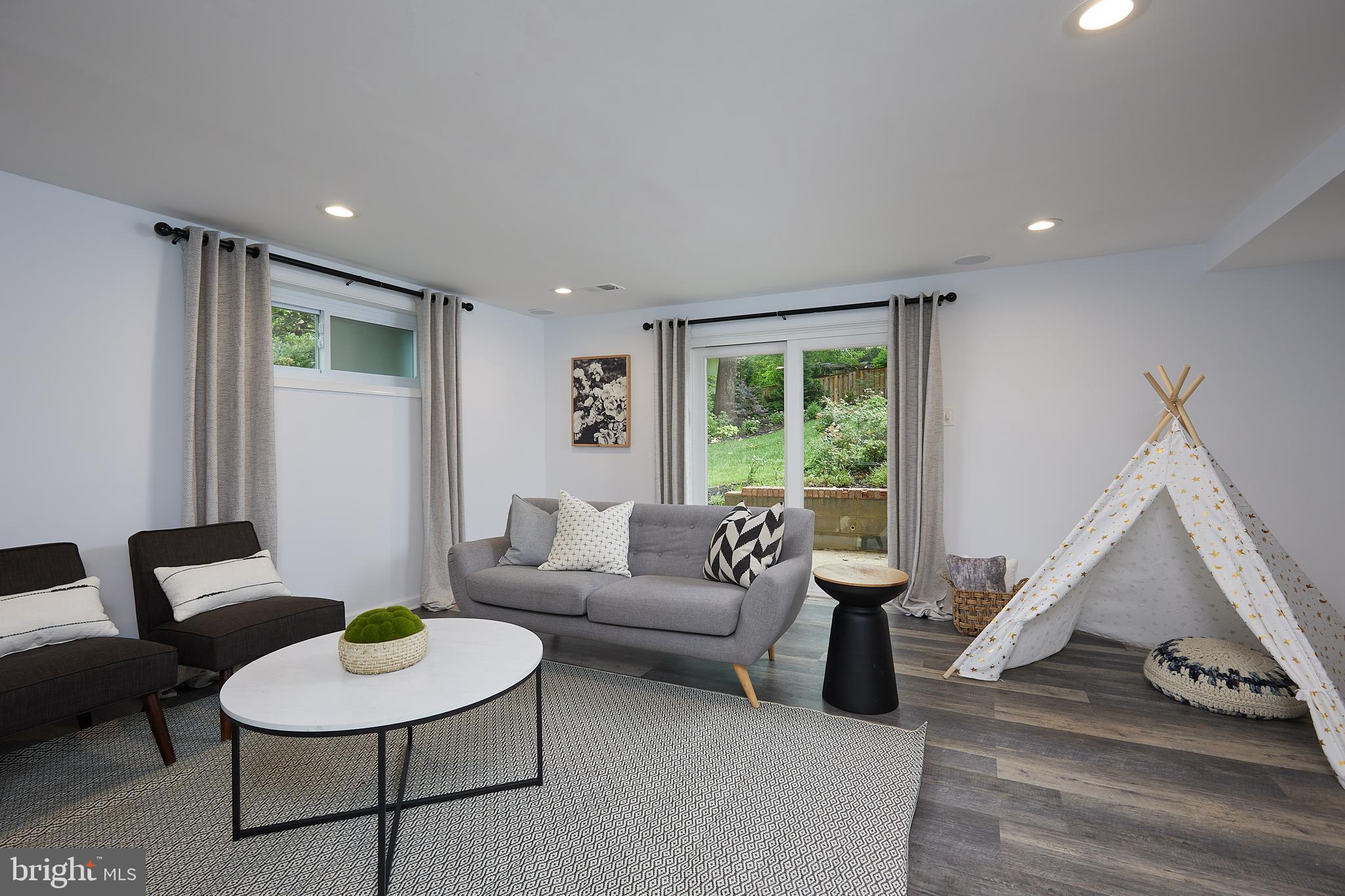 10611 Glenwild Road Silver Spring, MD 20901 - Photo 29 of 39 a living room with furniture and a large window