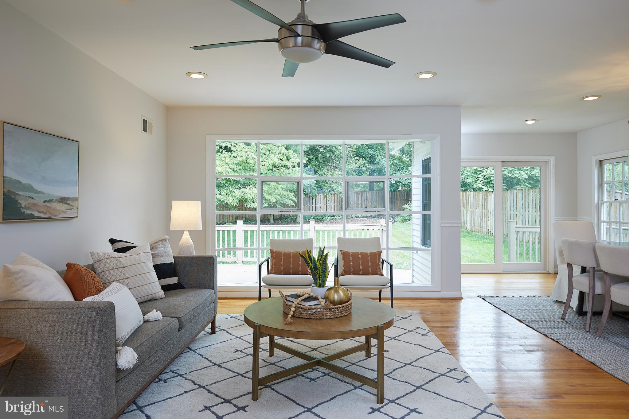 10611 Glenwild Road Silver Spring, MD 20901 - Photo 4 of 39 a living room with furniture and a large window