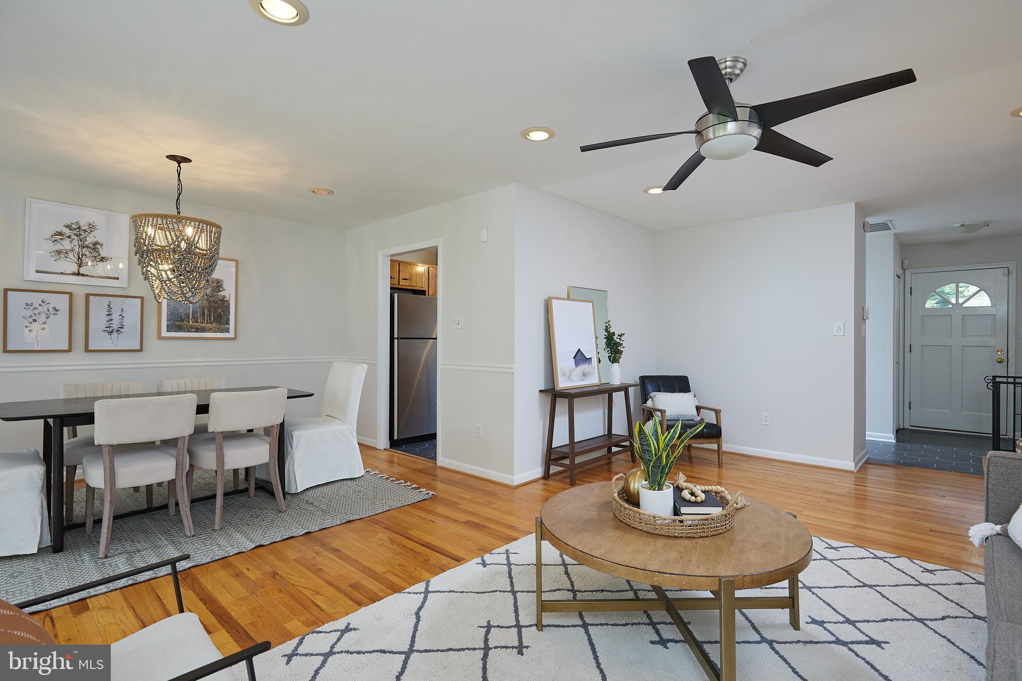 10611 Glenwild Road Silver Spring, MD 20901 - Photo 37 of 39 a living room with furniture and a wooden floor