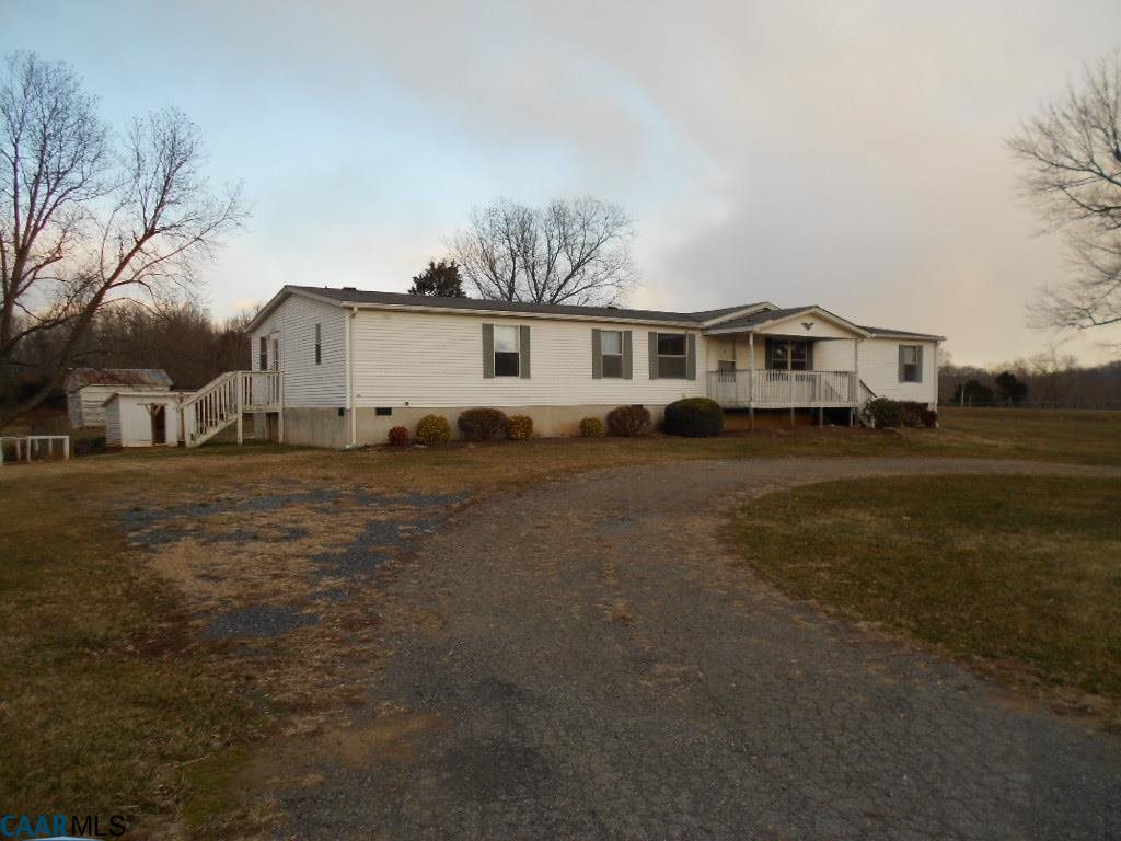 a view of a house with a big yard