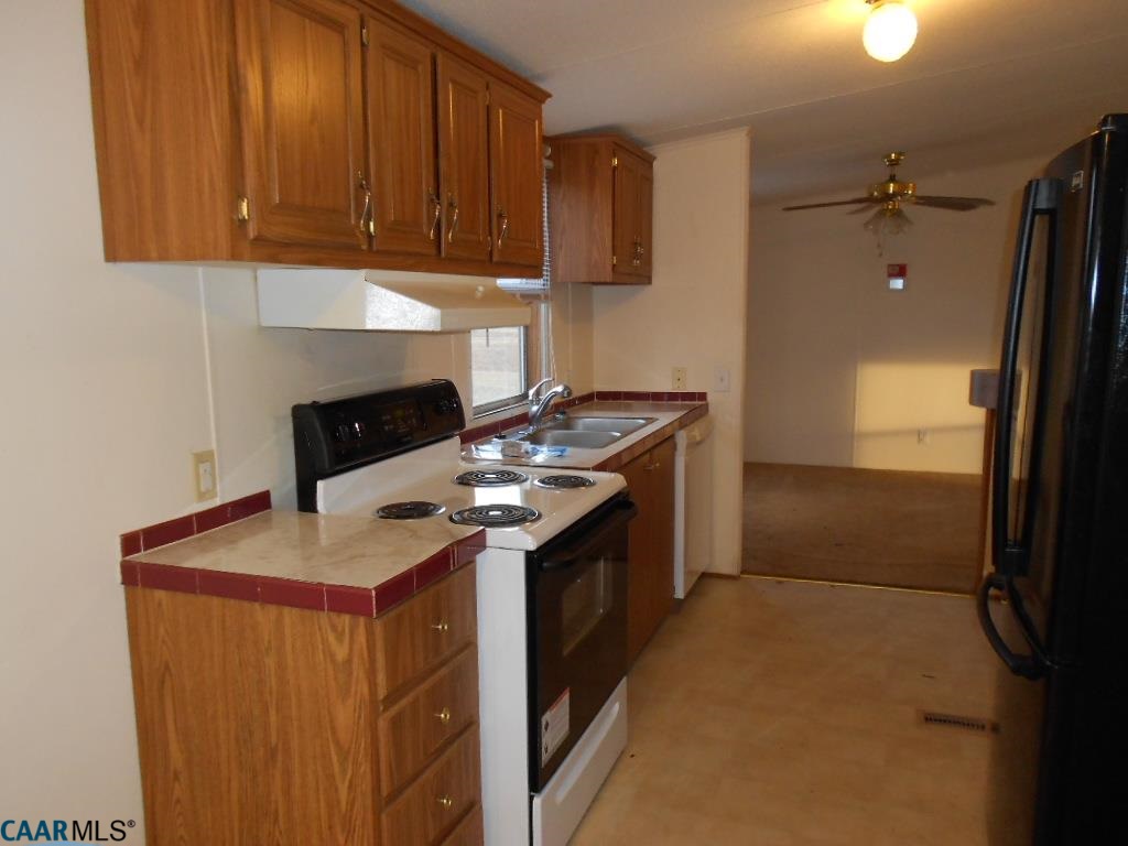3135 Orange Road Aroda, VA 22709 - Photo 5 of 10 a kitchen with a stove and a refrigerator