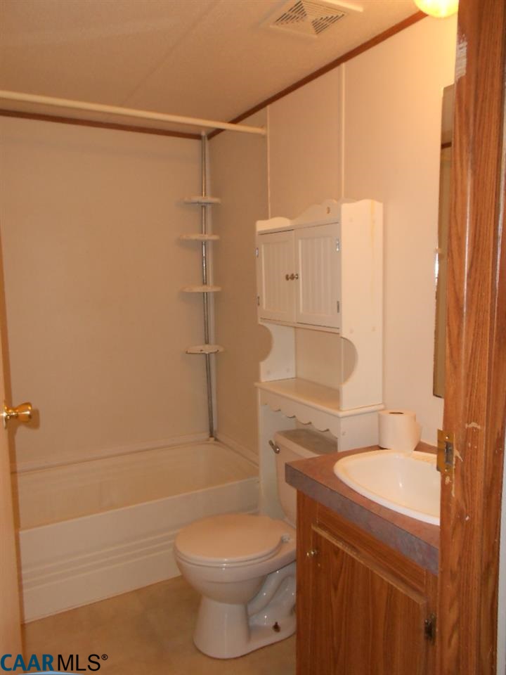 3135 Orange Road Aroda, VA 22709 - Photo 9 of 10 a bathroom with a shower a toilet and sink