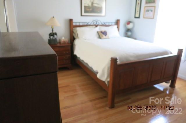 205 Towne Court Conover, NC 28613 - Photo 11 of 19 a bedroom with bed and wooden floor