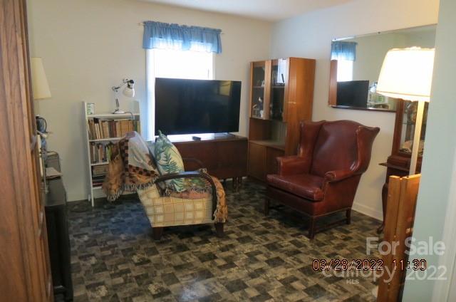 205 Towne Court Conover, NC 28613 - Photo 14 of 19 a living room with furniture fireplace and a flat screen tv