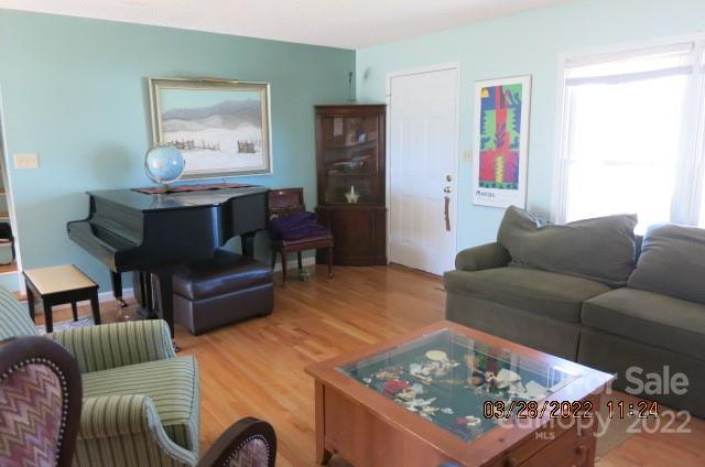 205 Towne Court Conover, NC 28613 - Photo 2 of 19 a living room with furniture a rug and a window
