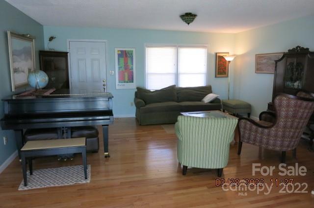 205 Towne Court Conover, NC 28613 - Photo 4 of 19 a living room with furniture and a wooden floor