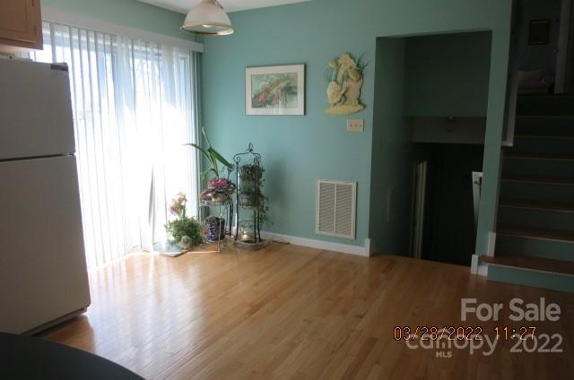 205 Towne Court Conover, NC 28613 - Photo 5 of 19 a view of an empty room with wooden floor and a window