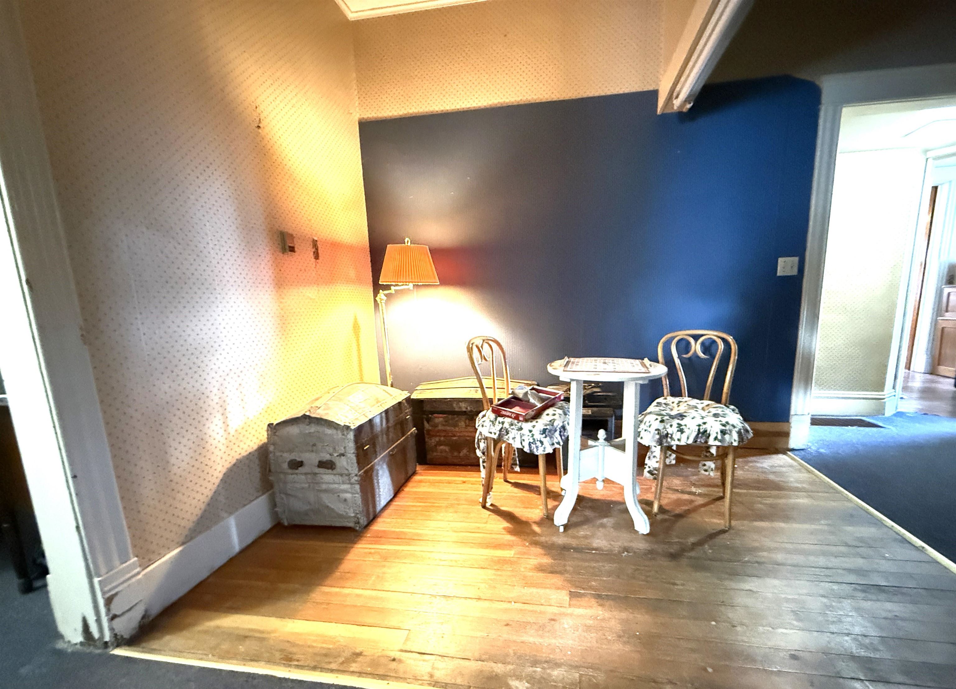 323 South Main Street Stockton, IL 61085 - Photo 16 of 32 a living room with furniture and a table