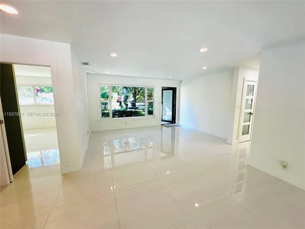 a view of hallway with livingroom