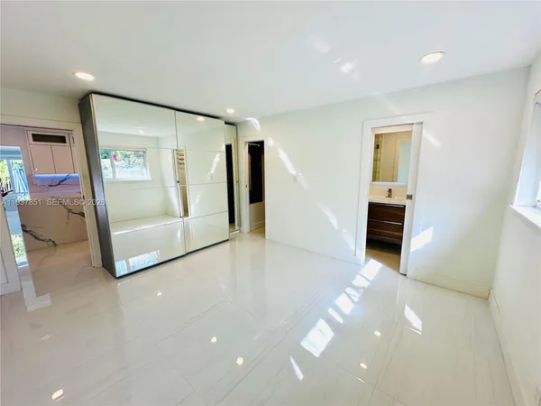 a bathroom with a sink a double vanity and a mirror