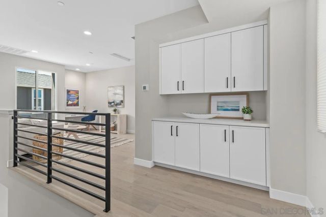 a view of cabinets and wooden floor