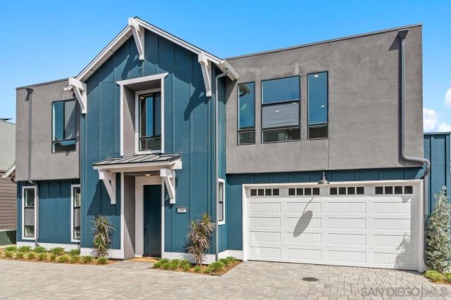 a front view of a house with garage