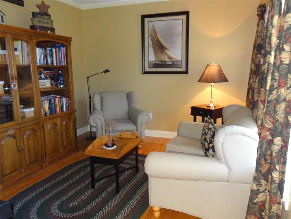 43 Quabbin Path Sutton, MA 01590 - Photo 12 of 29 a living room with furniture and a lamp