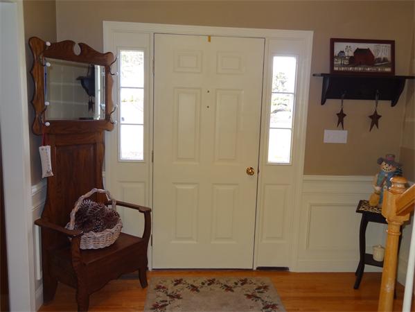 43 Quabbin Path Sutton, MA 01590 - Photo 23 of 29 a room with a mirror and a wooden floor