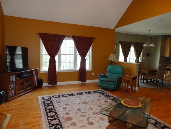 43 Quabbin Path Sutton, MA 01590 - Photo 3 of 29 a living room with furniture and a flat screen tv
