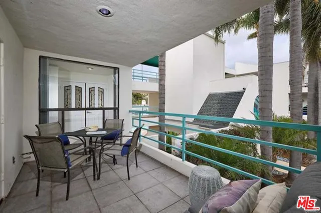 a view of a chairs and table in a patio