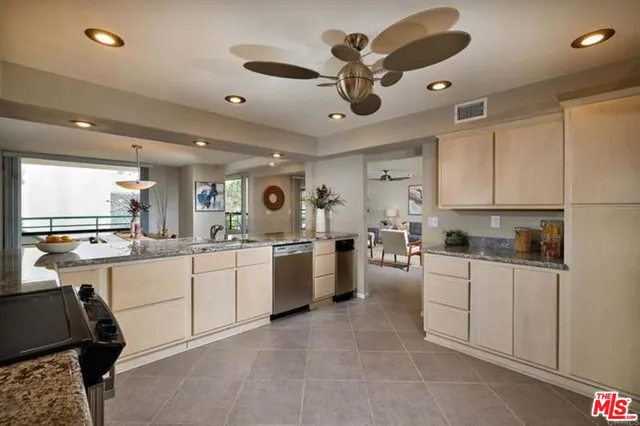 a kitchen with sink cabinets and window