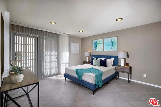 a bedroom with a bed and a table